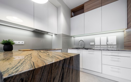 Modern kitchen interior design in white with marble counter