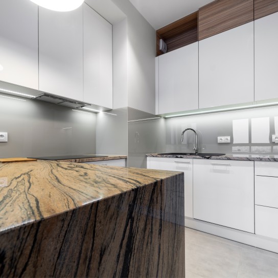 Modern kitchen interior design in white with marble counter