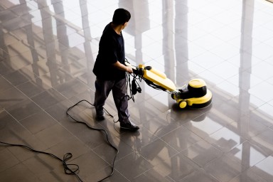 Man vacumming the floor