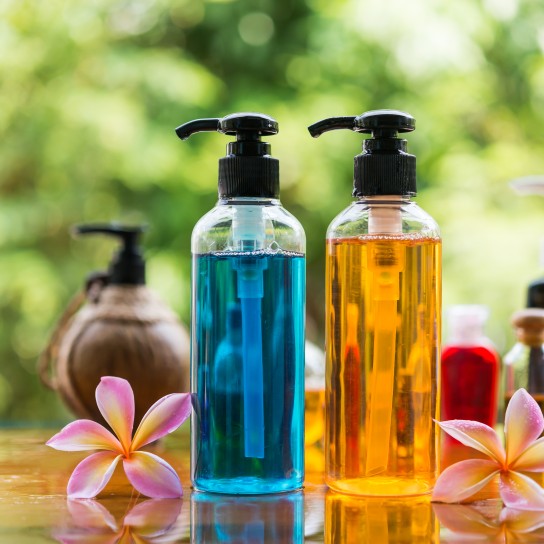 Body care product,shower and shamphoo with plumeria flower on nature background