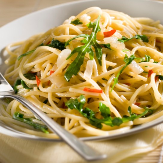 Spaghetti dish with chili and rocket close up shoot