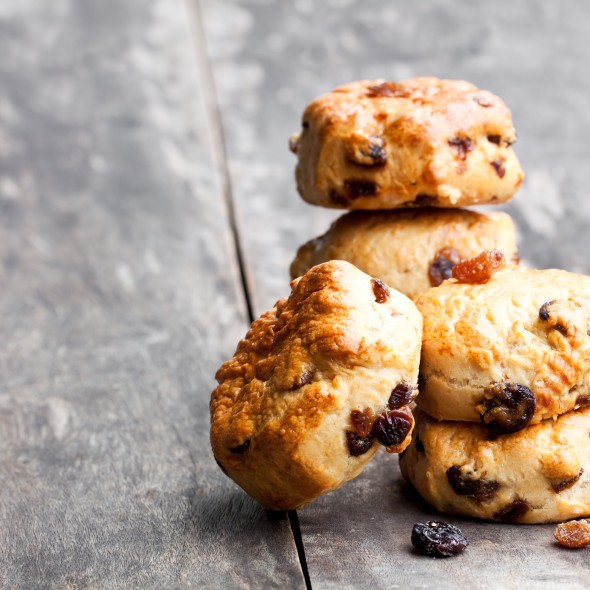 Homemade sultana scones on wooden table