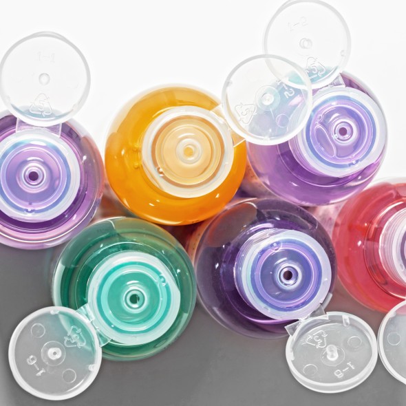 colored bottles for cosmetics, cosmetics and shampoos, top view