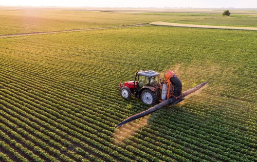 Aerial view of a tractor spraying 