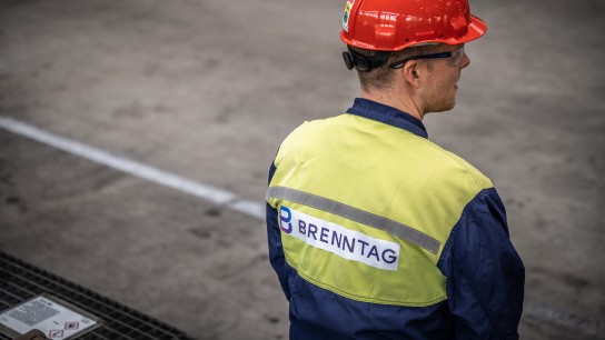 A look over the shoulder of a Brenntag employee in the warehouse, Duisburg, Germany