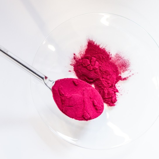 Checking the texture of the powder in the application center, Essen, Germany