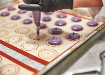 Brenntag expert portions the dough for the macaroons, Allentown, USA