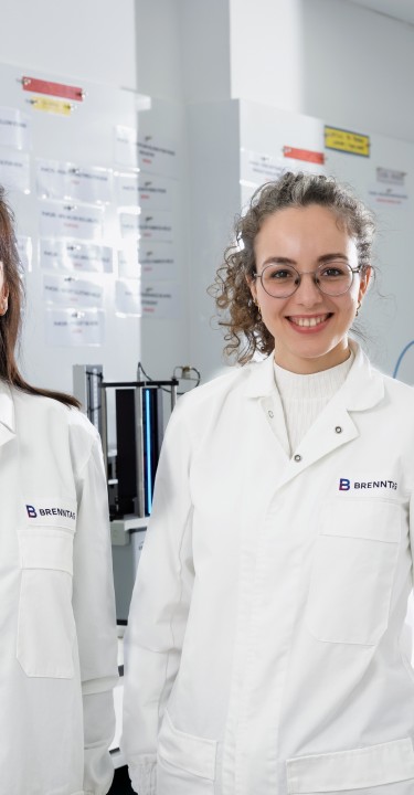 Three women smiling into the camera in the HI&I Innovation & Application Center in Barcelona, Spain