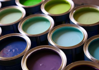 Open tins of brightly coloured paint in rows.
GettyImages-1204904063.jpg
