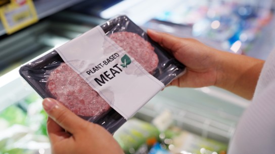 Close-up hand carry choose zero pork soy bean faux peas cutlet gluten free read beyond non-meat lab label. Buy raw fake beef tray in asia store veggie burger patty for health care eat diet meal cook.
GettyImages-1432124519.jpg