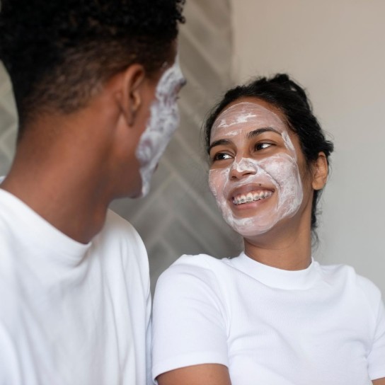 Facial, bathroom or happy couple with mask for skincare, cosmetics and detox treatment. Relax, face and man with love, smile or woman in morning routine at home for dermatology, wellness and beauty
GettyImages-1969946813.jpg