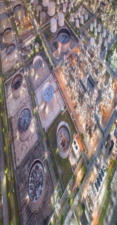 Aerial view of Oil refinery and gas industry in Petrochemical plant at twilight