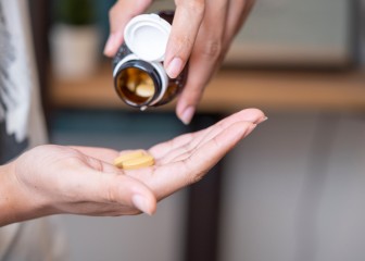 Man taking vitamins and supplements