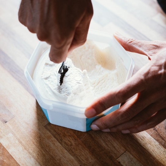 A man preparing vegan frozen yogurt / ice cream