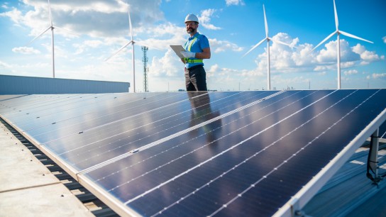 Engineer checking solar panels on a solar power plant
