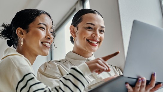 Laptop, planning and startup business women team for website design, social media marketing or email communication success. Empowerment entrepreneur people reading career newsletter or blog update_Excellence