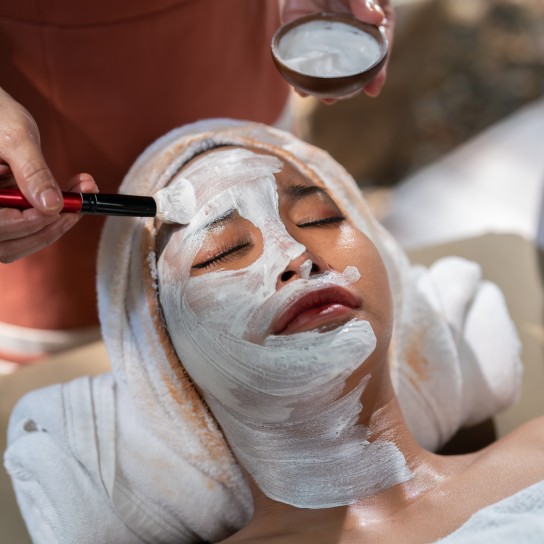 Business doing Massage care business.Woman performs alternative therapy to health spa to take care of her body.Beautiful woman lying with her eyes closed and relaxing her skin.