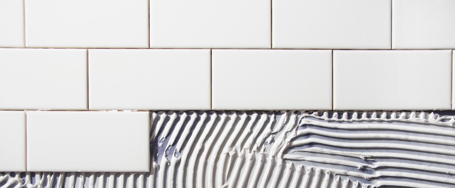 Paintbrush on open tins with pigments