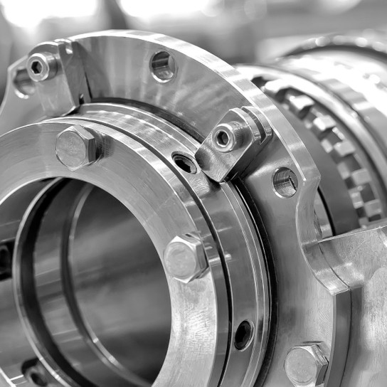 Steel parts for industrial machinery round shape. Black and white toning. Close up.