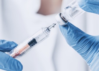 injecting injection vaccine vaccination medicine flu man doctor insulin health drug influenza concept - stock image