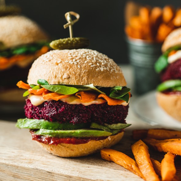 Cropped image of three vegan burgers representing the quality of vegan food