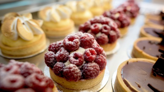 Window of delicious desserts at a pastry shop - food concepts