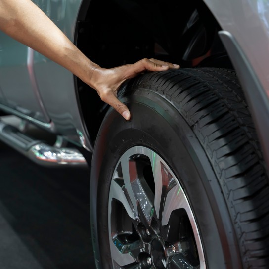 Hand man checking air pressure air car tire