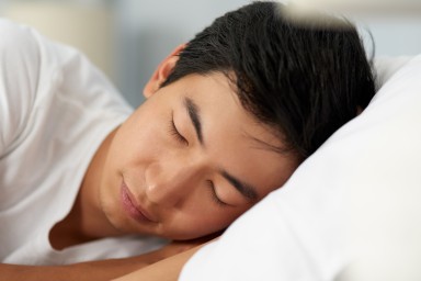 Cropped shot of a handsome young man sleeping in his bed in the morning
GettyImages-1155375319.jpg