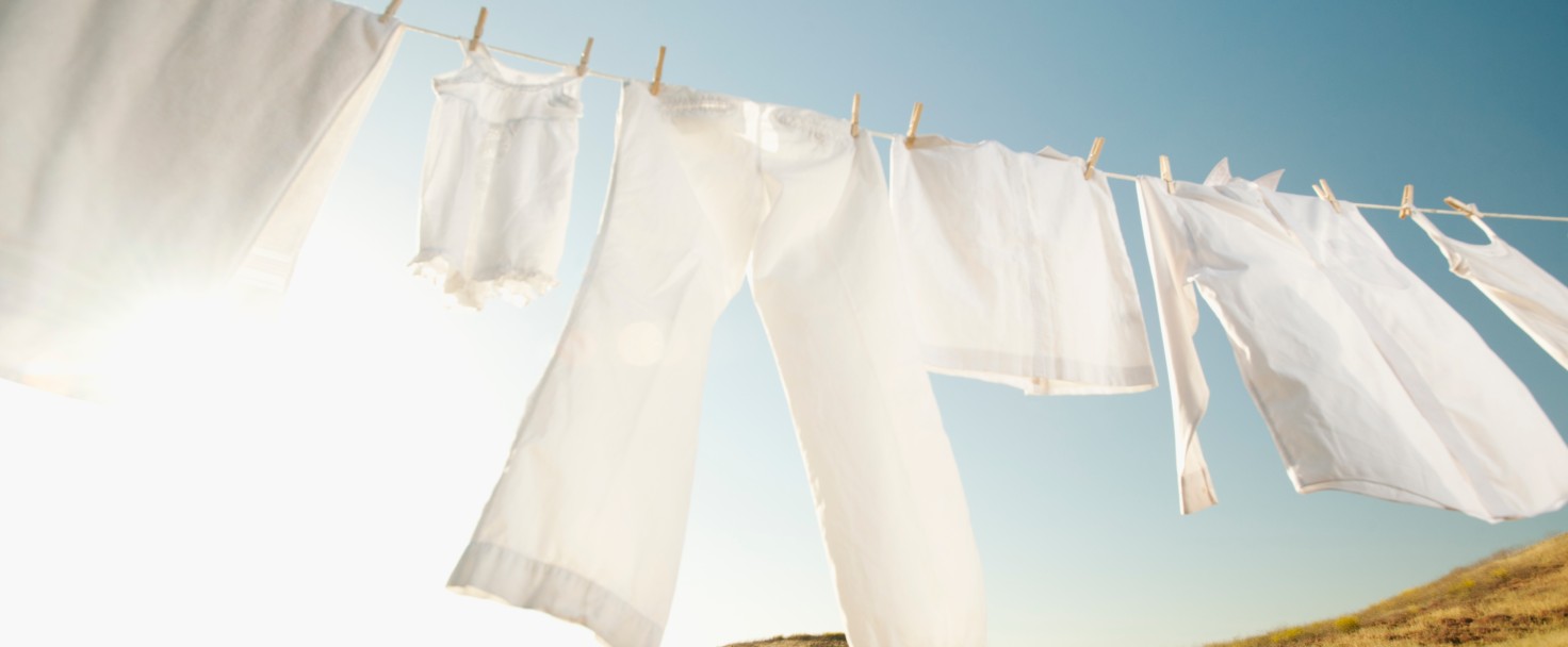 USA, California, Ladera Ranch, Laundry hanging on clothesline against blue sky