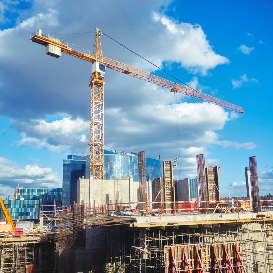 Construction site crane at blue sky background