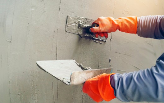 Hand image worker Concrete plaster
