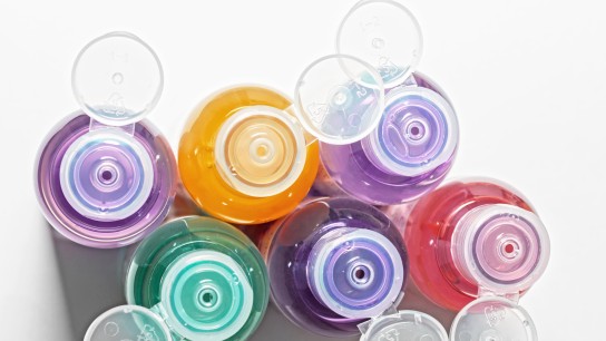 colored bottles for cosmetics, cosmetics and shampoos, top view