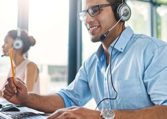 Beautiful woman applying makeup