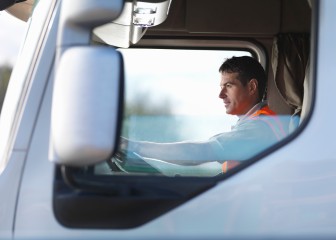 Close up of a truck driver in a truck