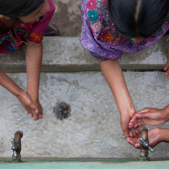 Kids washing their hands in a sink, Guatemala