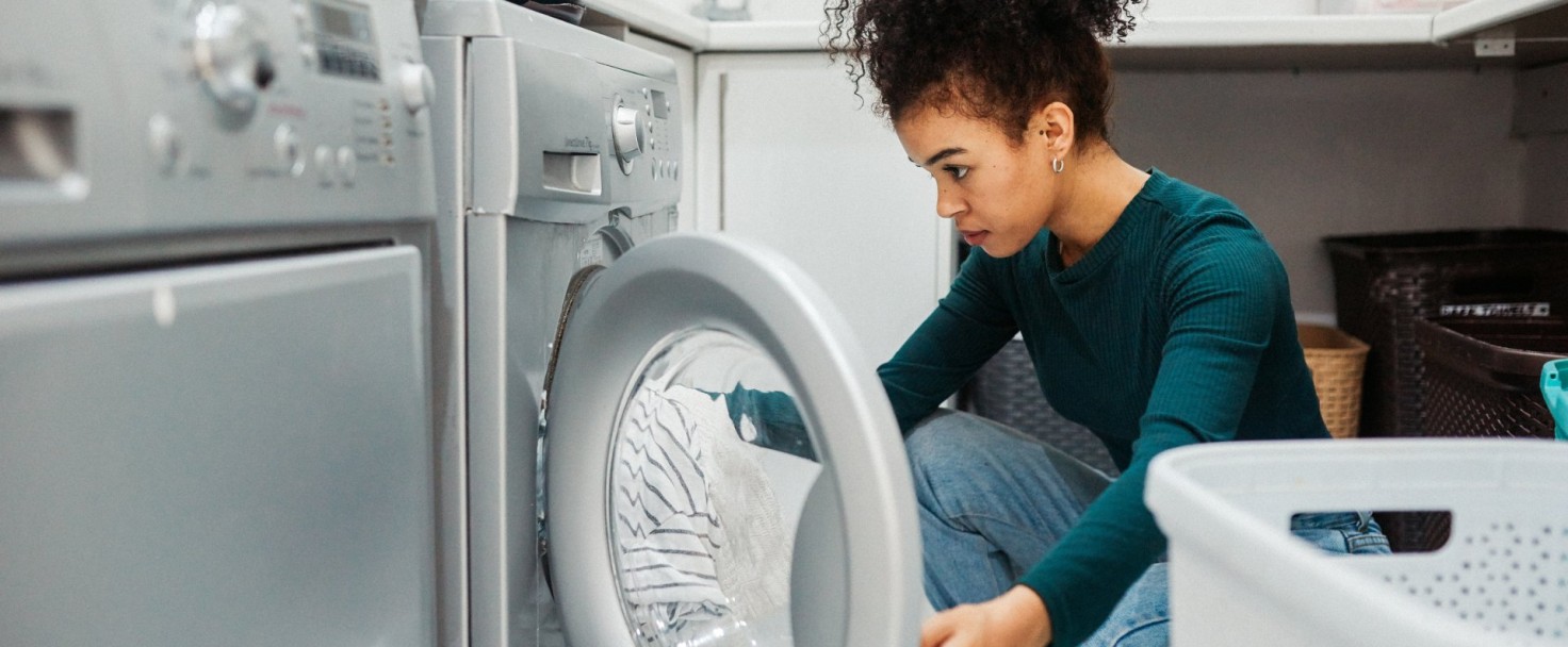 Shot of a young woman using a washing machine to do laundry at home
GettyImages-1190345490.jpg
