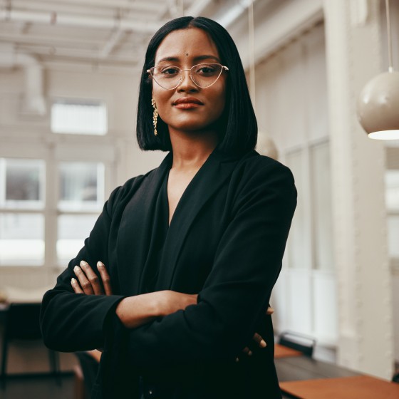 Portrait of a confident young businesswoman working in a modern office
GettyImages-1299077558.jpg