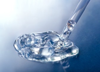 Liquid transparent gel serum swatch with pipette on blue color glass background. Cosmetic product for skin care or medical clear liquid gel
GettyImages-1317005800.jpg