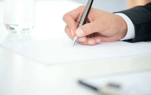 Man Signing Contract Paper
