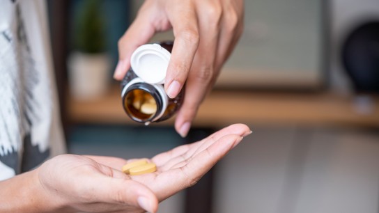 Man taking vitamins and supplements