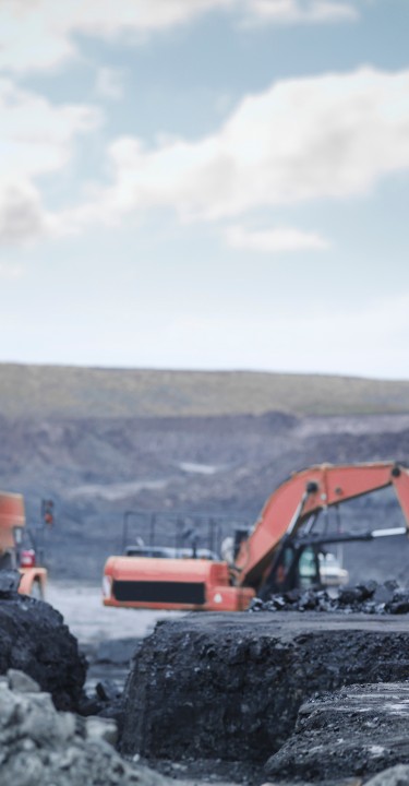 Miners in discussion in surface coal mine