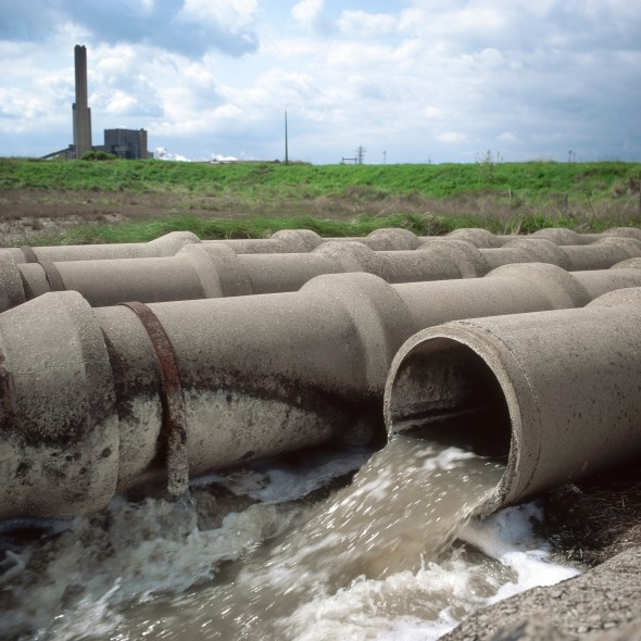 Outflow of wastewater from large industrial complex to estuary.