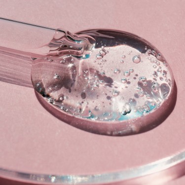 Pipette with sample of gels cosmetic product in petri dish on pink background, hard shadows.
GettyImages-1412343603.jpg