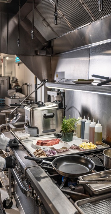 Food ingredients on a kitchen table in from of the chef