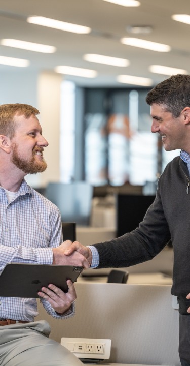 Brenntag colleagues shaking hands on a decision, Houston, USA