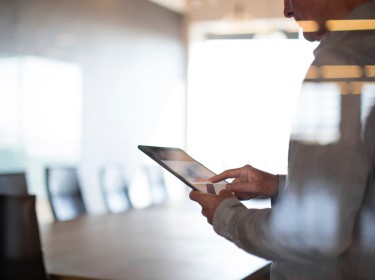 Businessman using tablet in conference room