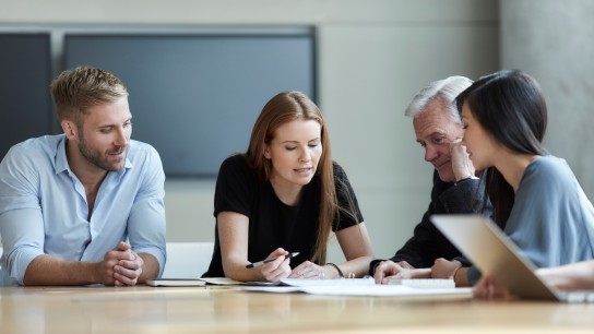 Business people reviewing paperwork