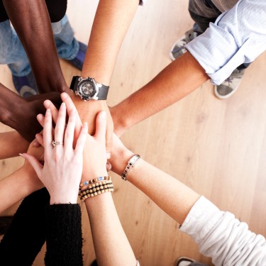 Group with hands together