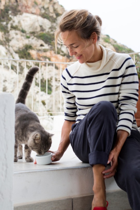 Woman feeding her cat