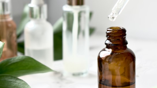 Facial serum, care cosmetics, facial and body treatments, anti-aging lotion, glass jar with pipette